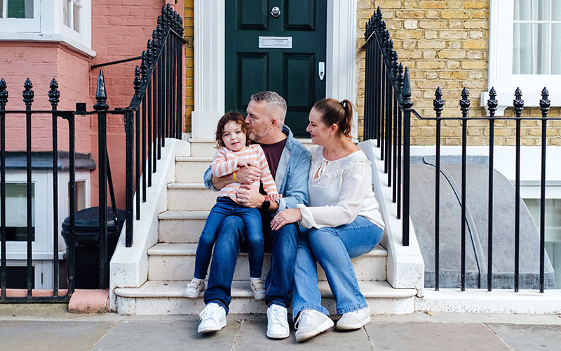 Family type outside their property
