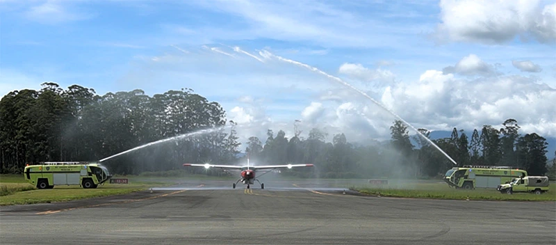 Kagamuga firefighters performing a ceremonial salute over P2-AFD