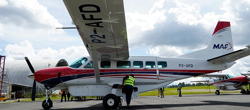 A MAF worker in hi-vis accessing the compartment under P2-AFD