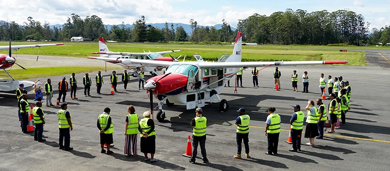 MAF staff perform a circle around P2-AFD in prayer